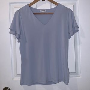 Medium powder blue Calvin Klein blouse.